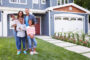 Happy black family standing outside their house for home remodel
